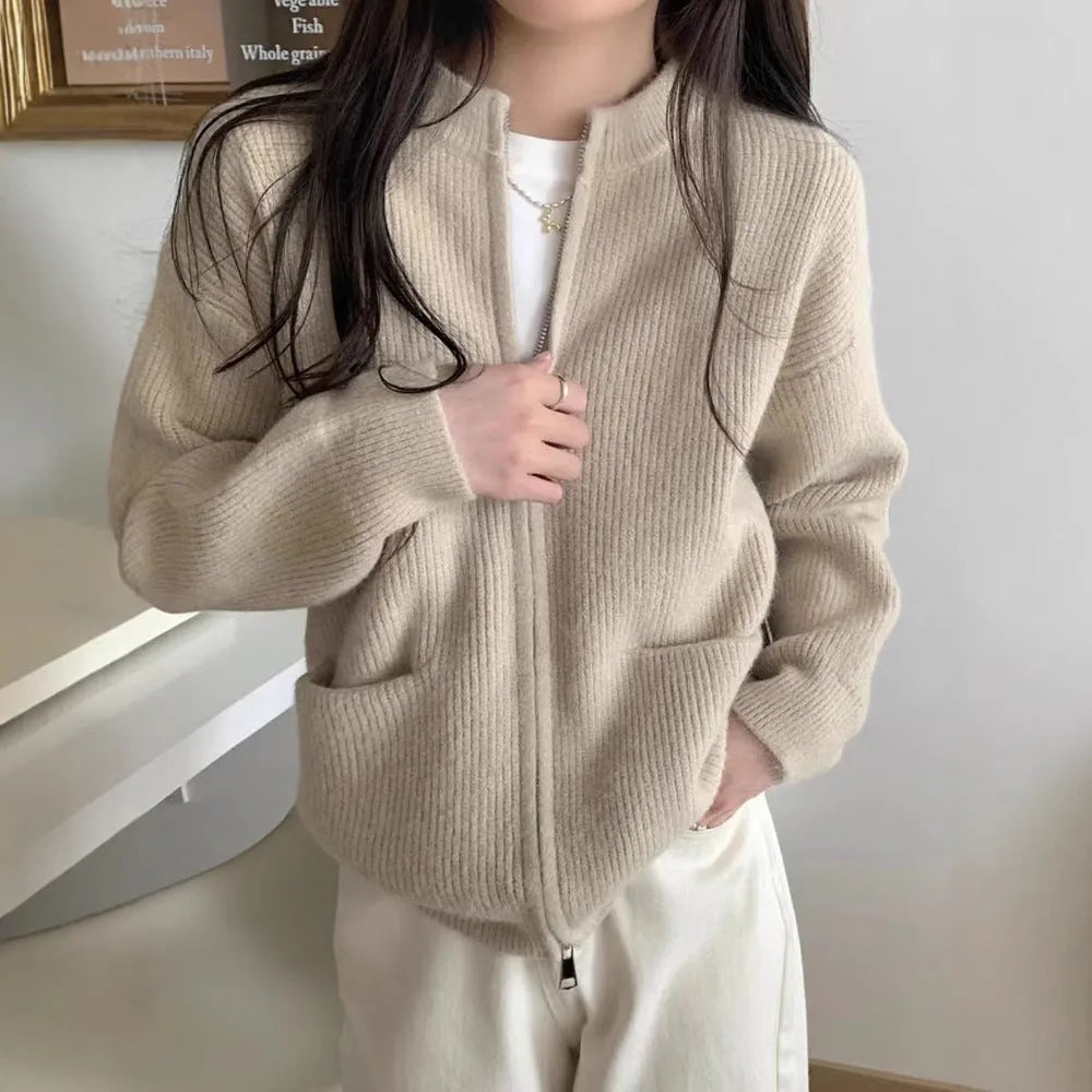 Beige viscose fibre long-sleeve sweater coat cardigan laid flat, showing soft drape and button front.