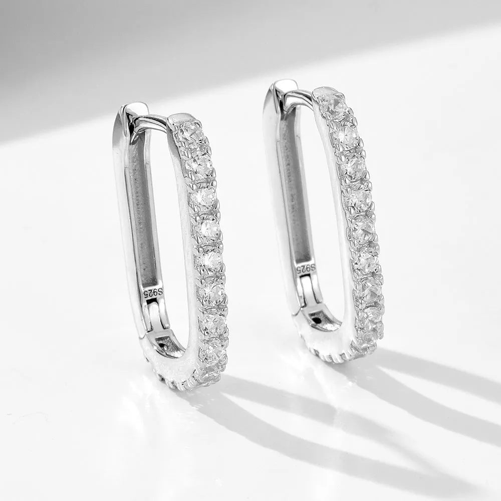 Sterling silver ear clip earrings with oval zircon stones in geometric design