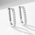 Sterling silver ear clip earrings with oval zircon stones in geometric design