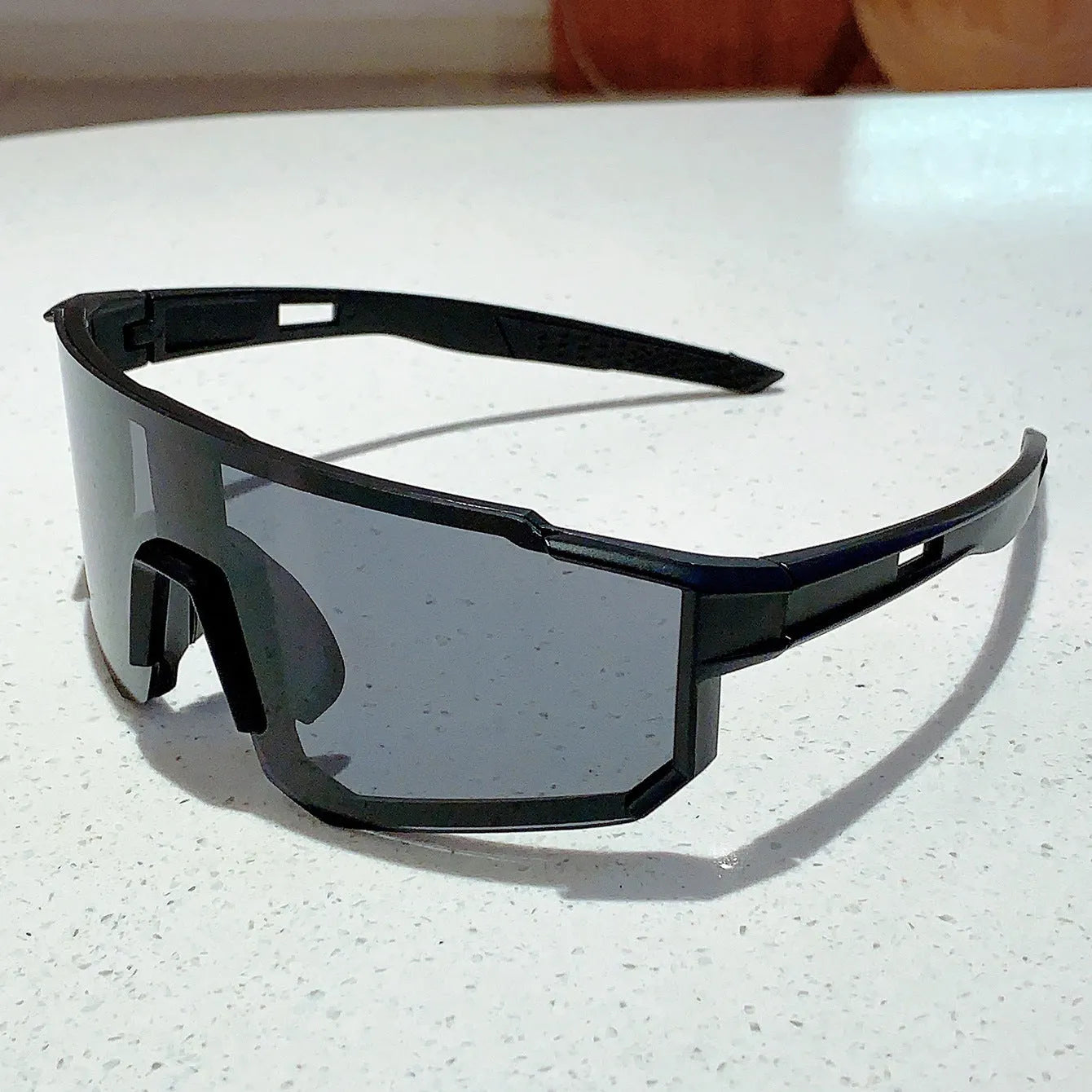 Large frame unisex cycling sunglasses with black frame and red mercury silver-strip lens