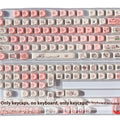 Pink PBT plastic key cap with a detailed sublimation-printed pig design and a keycap puller.