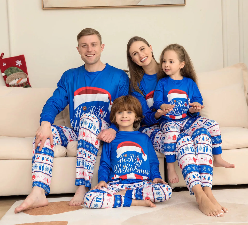 Matching family Christmas pyjamas set with letter print top and plaid pants in adult, child, baby, and dog sizes