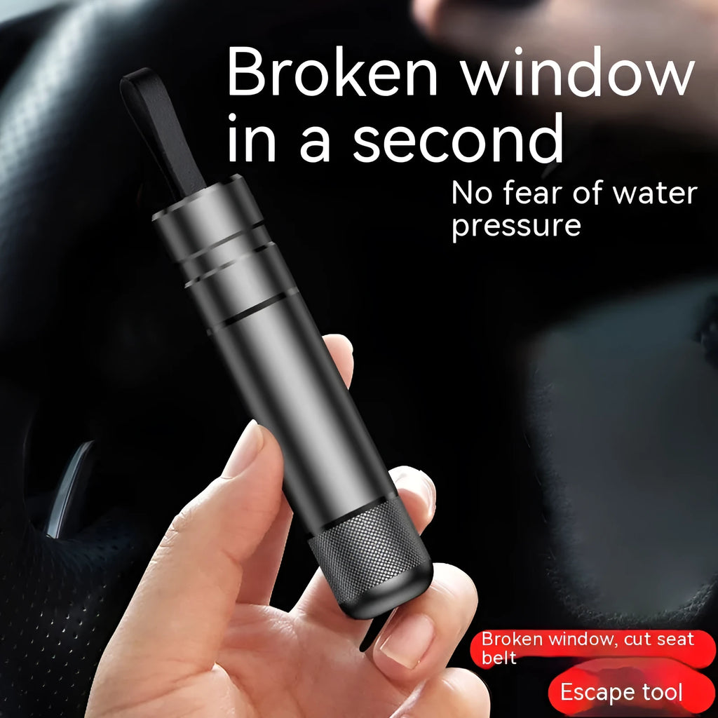 Aluminium alloy car safety escape hammer with textured finish on a dark background.
