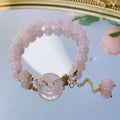 Pink crystal bracelet with peace symbol safety buckle clasp on woman's wrist