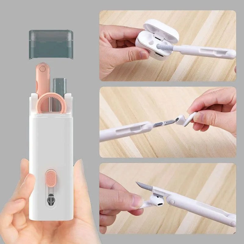 White multifunctional electronic cleaning kit with foldable pen, retractable brush, keycap puller, and spray bottle.