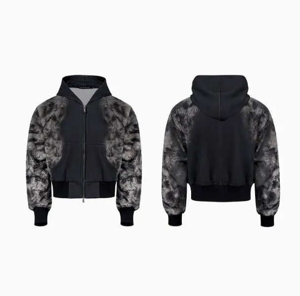 Loose fitting printed casual trousers with a hoodie on a neutral background