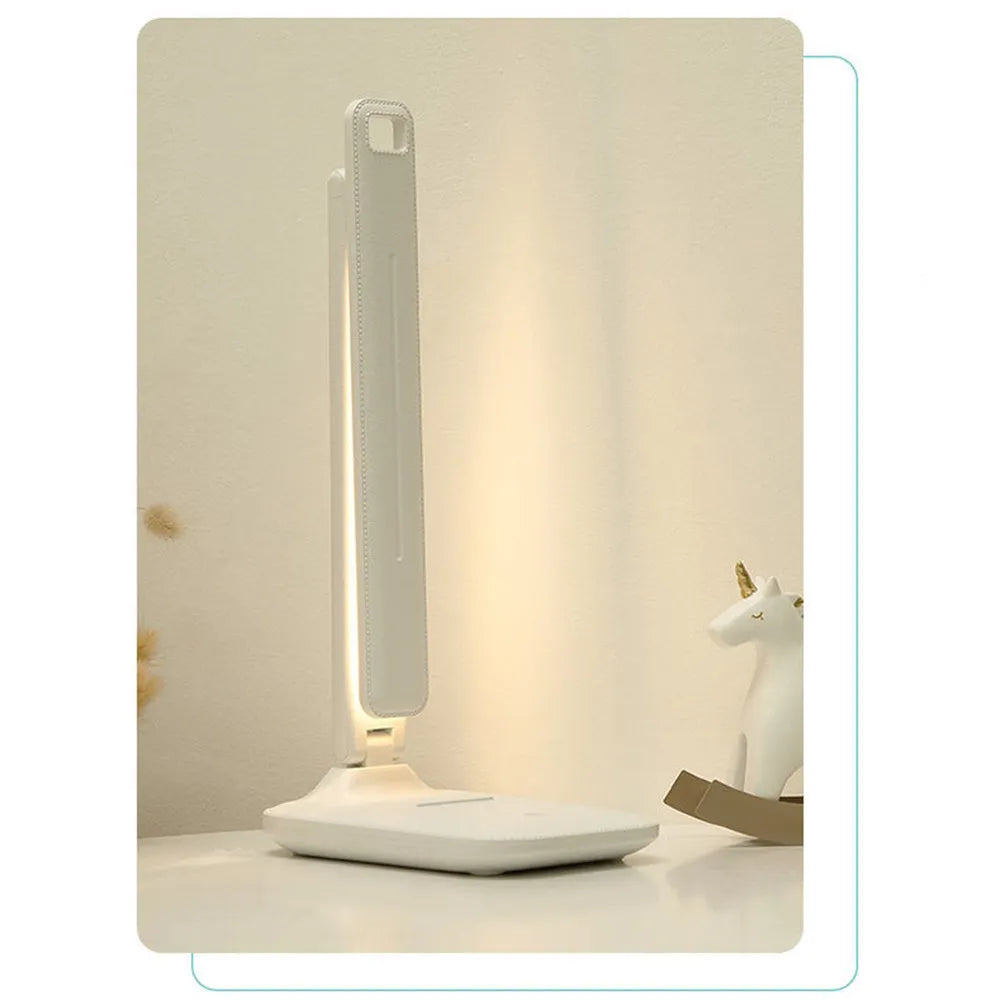 White plastic touch dimming bedside lamp with USB charging port.
