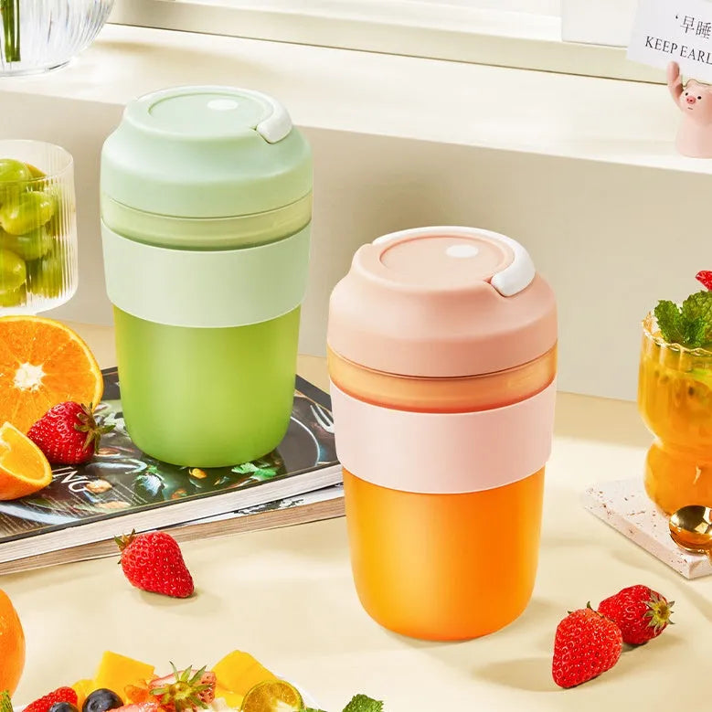 Grape purple portable USB blender cup with lid, showing stainless steel blades inside 400ml capacity bottle.