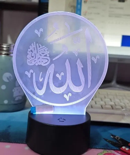 Religious 3D night light with black base and acrylic plate showing coloured illumination