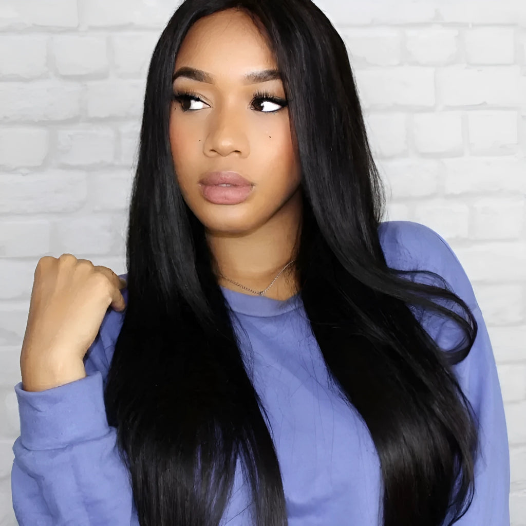 Long straight black synthetic wig with centre-parted bangs on a hair cover