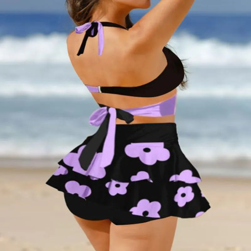Purple high-waist bikini with matching skirt and lace-up back detail