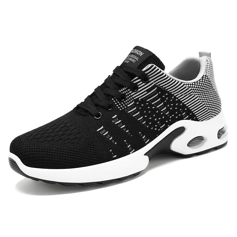 Men's low-top Flyknit mesh sneaker in black and grey colour with lace-up front and soft sole.