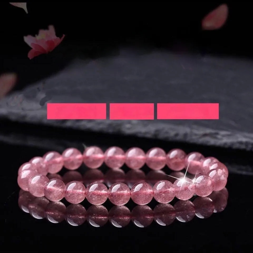 Women's fashion bracelet with polished strawberry quartz crystal beads.