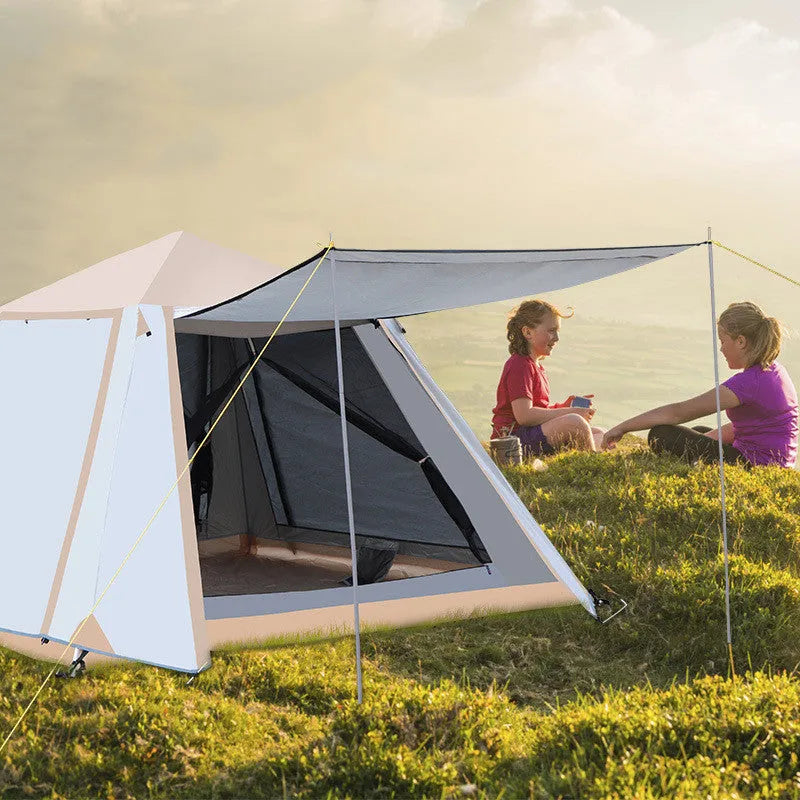 White fully automatic quick-open camping tent with aluminium poles, double-layer construction, pitched outdoors in a field