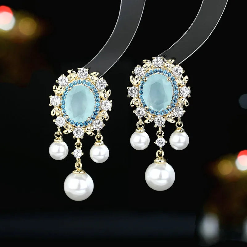 Oval geometric tassel earrings with zircon inlaid pearls in light purple, pink, or white.