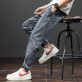 Men's loose cargo jeans in straight leg style with Korean workwear design