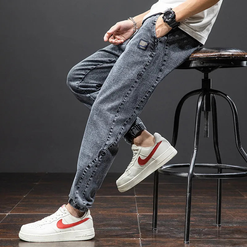 Men's loose cargo jeans in straight leg style with Korean workwear design