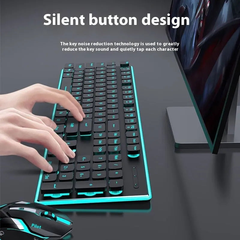 Compact wireless Bluetooth keyboard with mute button and pink backlight on a desk next to a tablet.