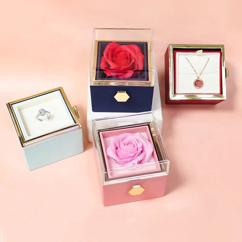 Rotating rose jewellery gift box with acrylic transparent cover showing preserved rose and rotating drawer open.