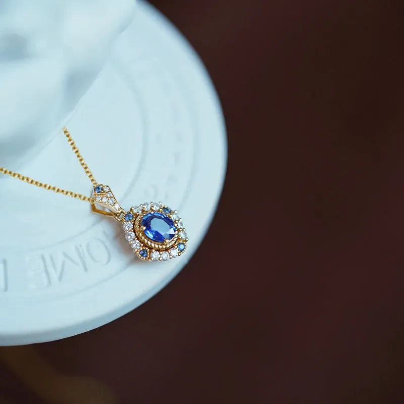 Yellow gold coloured copper necklace with a mixed gemstone pendant and box chain.