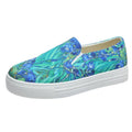 Women's blue colour match canvas trainers with flat rubber sole on a white background.