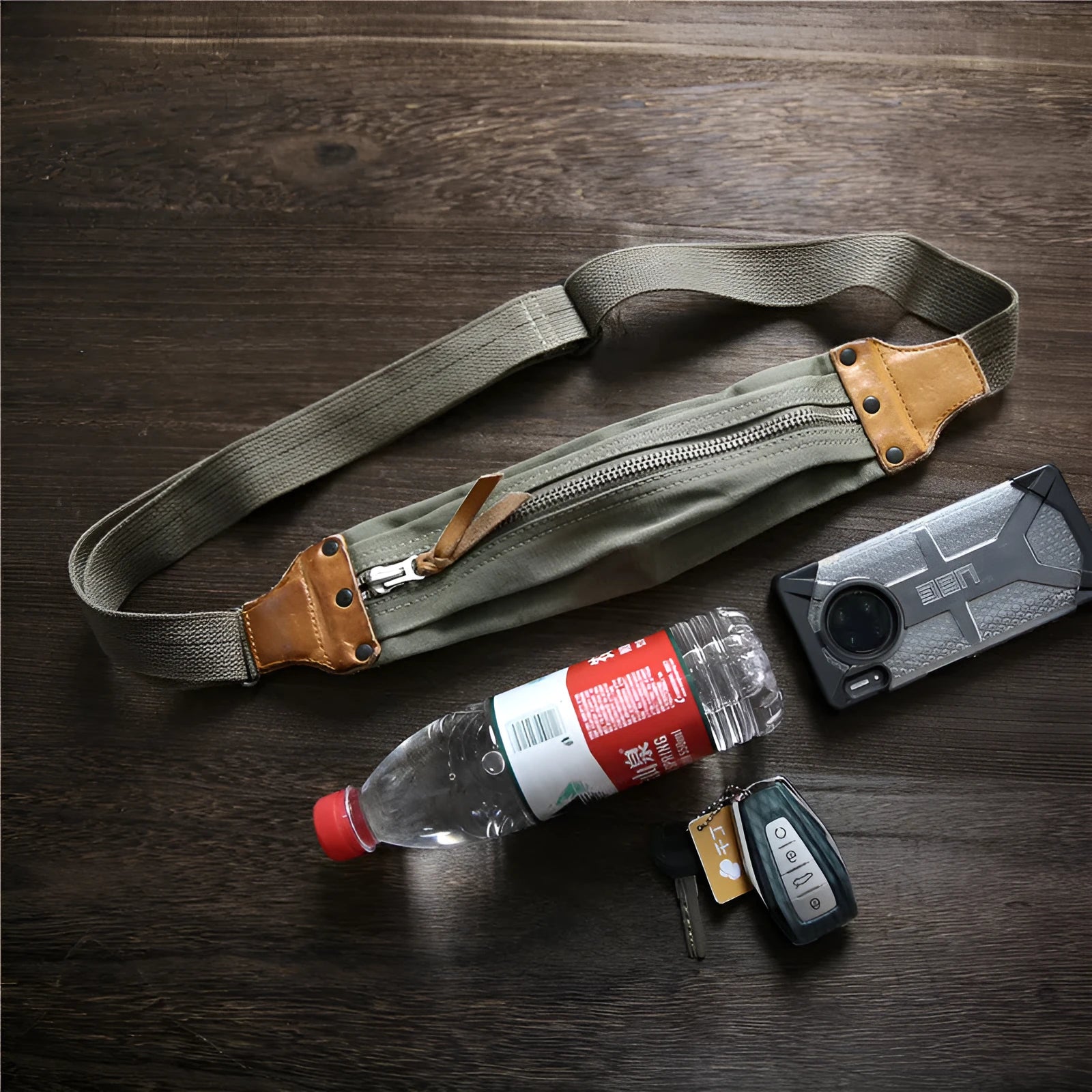 Green military style chest bag made from washed canvas with Italian cowhide leather trim
