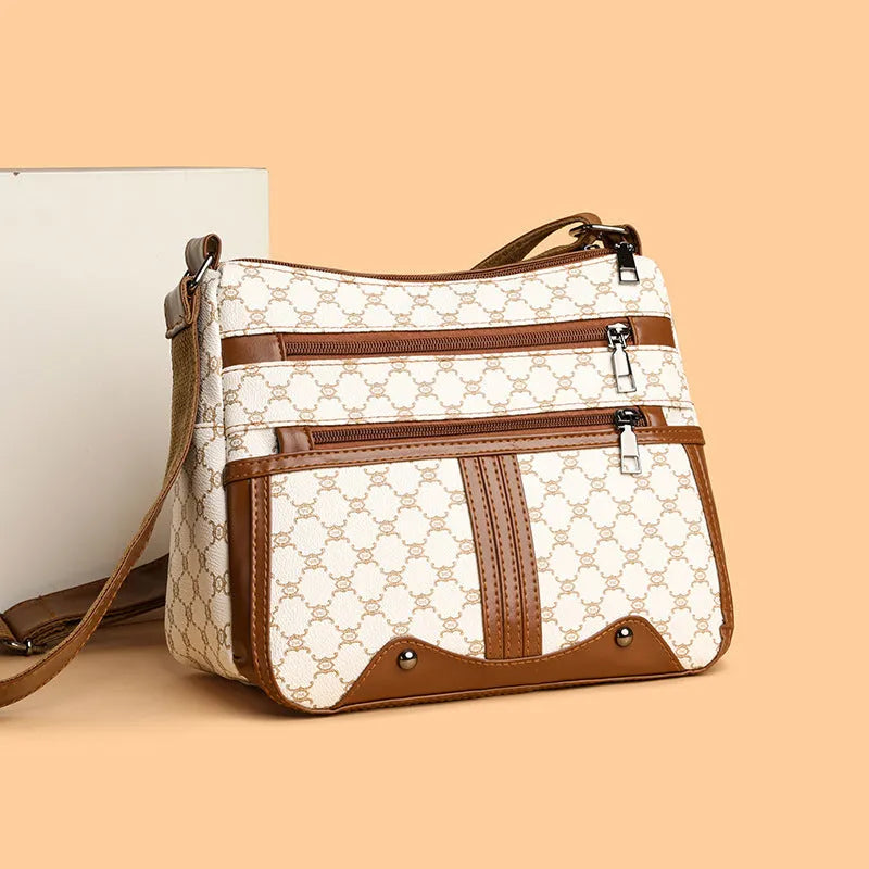 Brown women's crossbody bag with stitching pattern detail and large capacity interior