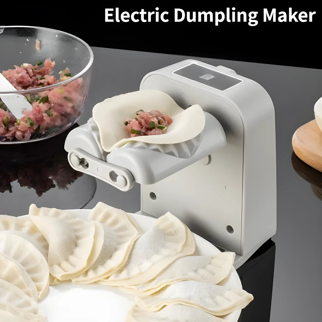 White electric automatic dumpling maker machine with accessories on a kitchen counter.