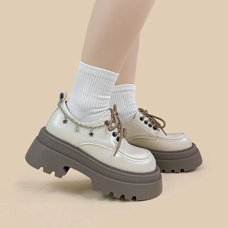 White women's platform Mary Jane shoes with a chunky heel and front lace-up fastening.