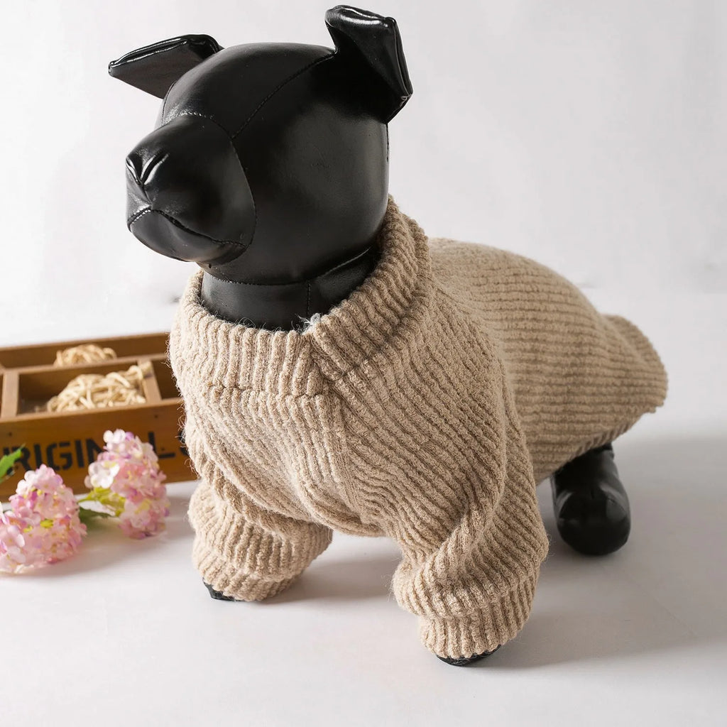 A brown knitted pullover sweater for a small dog on a mannequin.