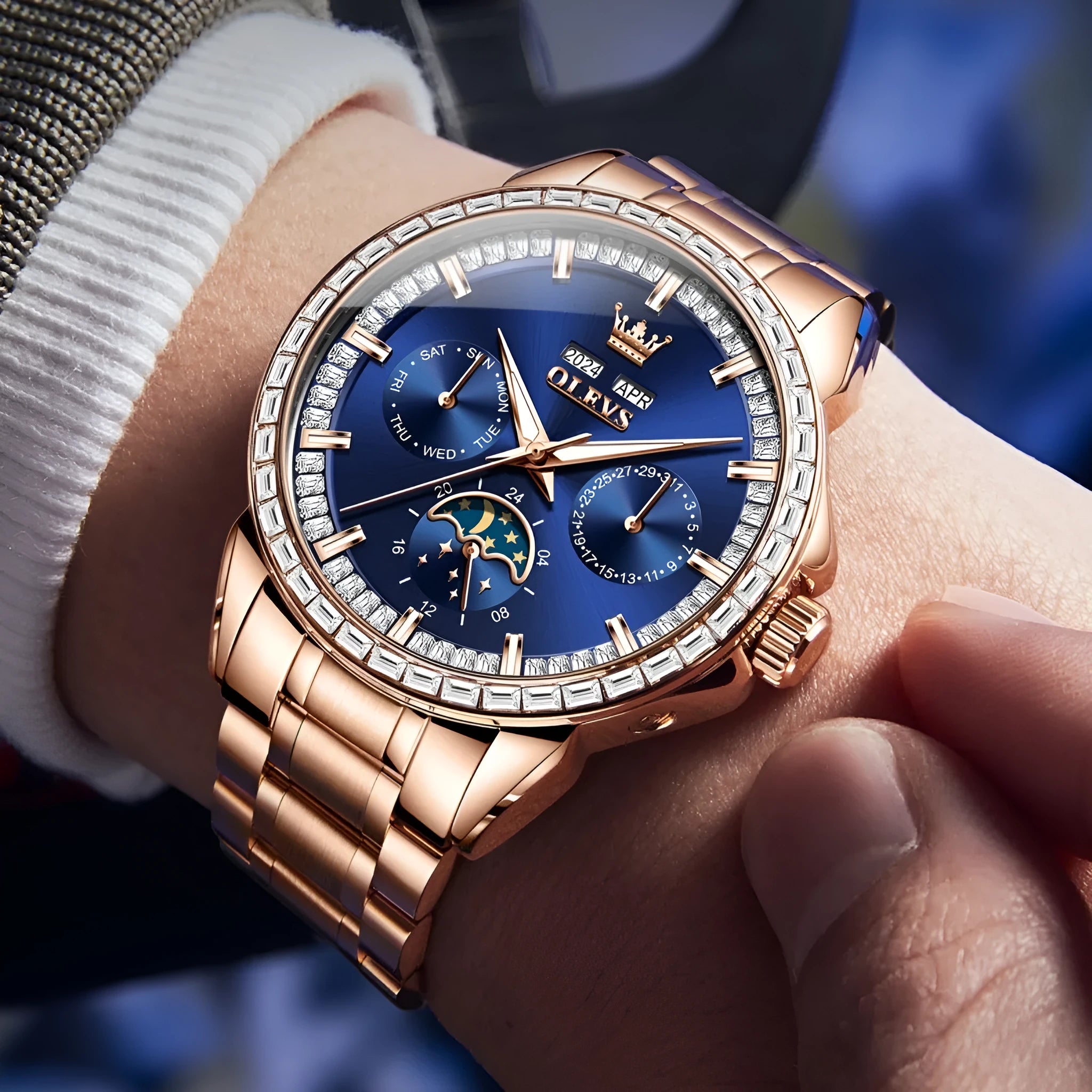 Men's automatic mechanical watch with diamond bezel and stainless steel strap on wrist.