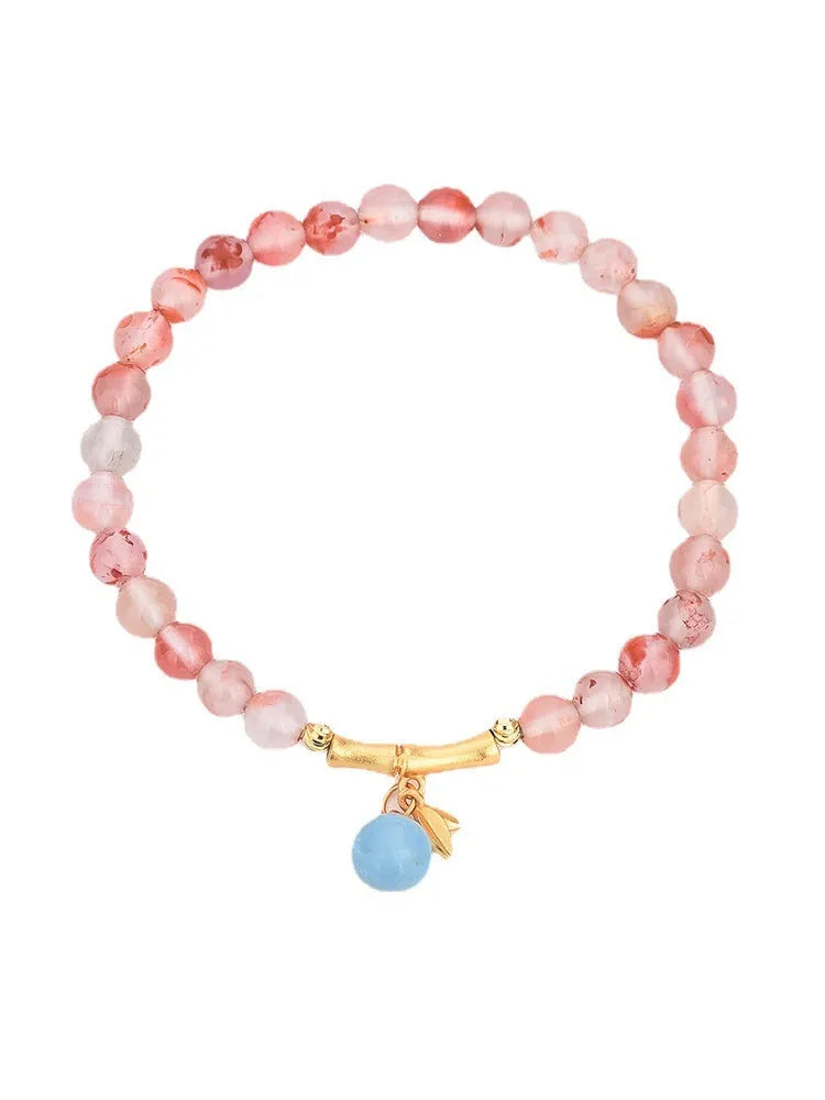 Ice Float Nanhong Agate bracelet with flower shape and bamboo joint details in ethnic style.