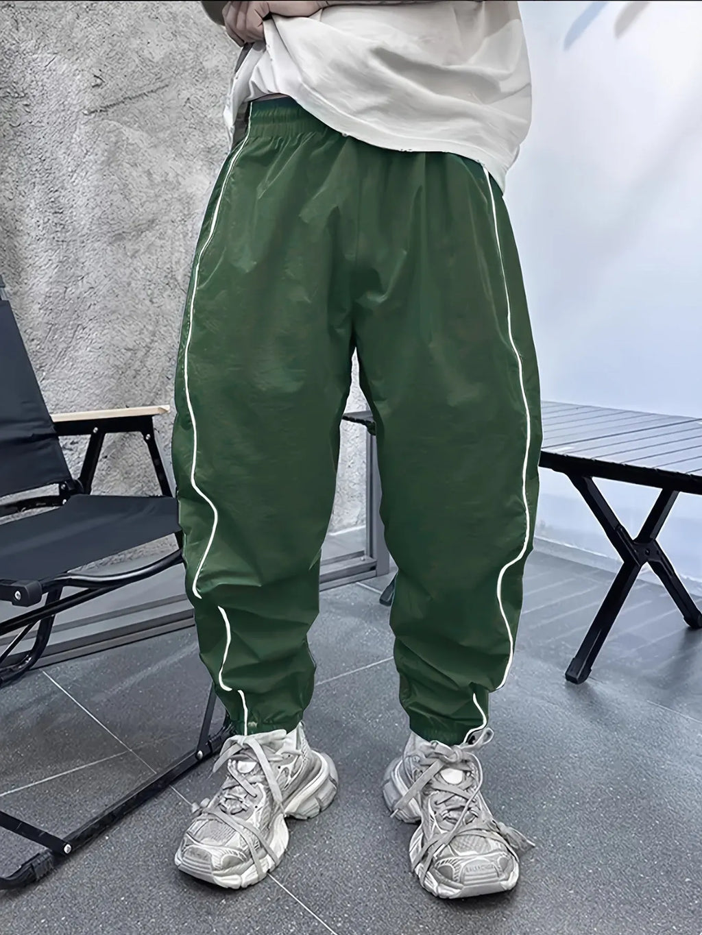 Men's blue bamboo fibre cropped casual sports trousers on a hanger.