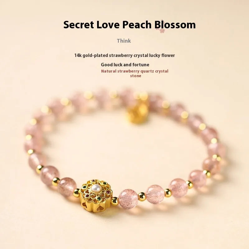 Gray moonstone and pink sunstone crystal bracelet with hand-woven cord and peach blossom quartz charms.