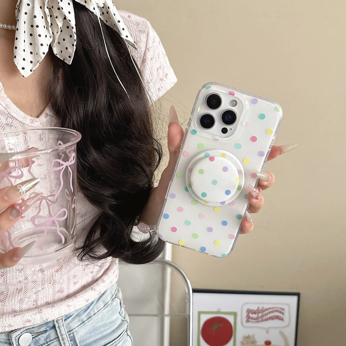 Polka dot iPhone case with magnetic bracket in black, pink, blue, and purple, compatible with iPhone models.