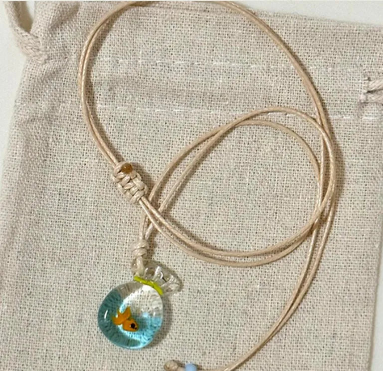 Women's necklace with a coloured glaze Skirt Everyday Joker pendant on a cotton and linen clavicle chain.