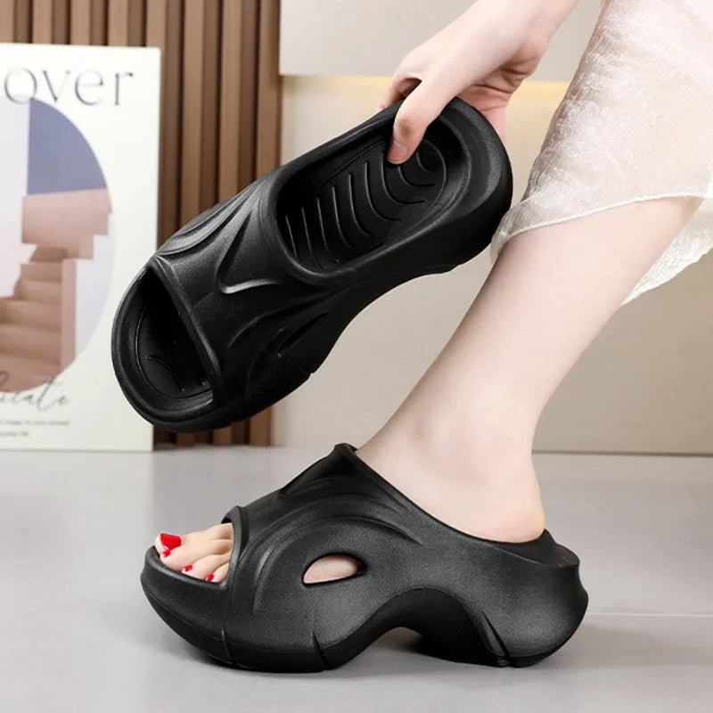 Women's thick-soled EVA beach slippers in rose red colour with round toe design.