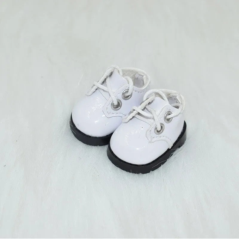 17cm high doll replacement shoes in various colours and styles on a white background.