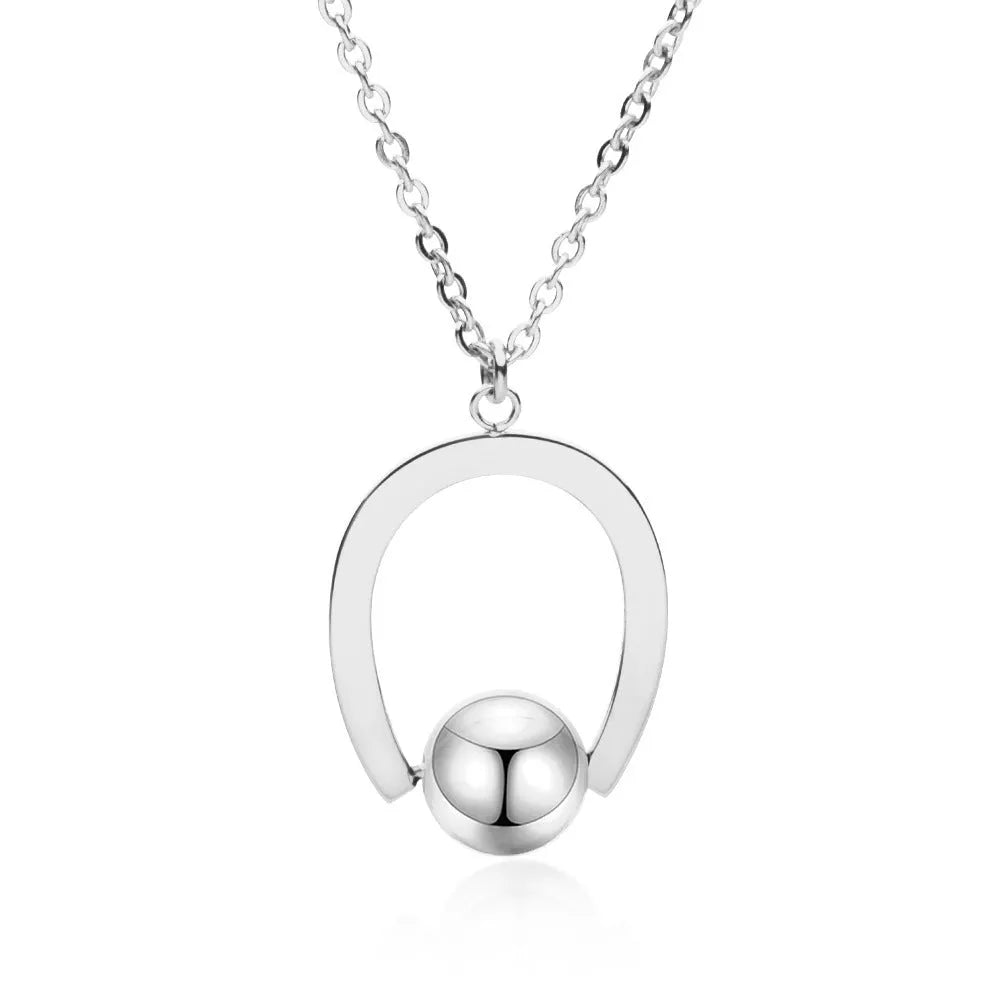Adjustable stainless steel necklace with a geometric pendant in a gold electroplated finish.