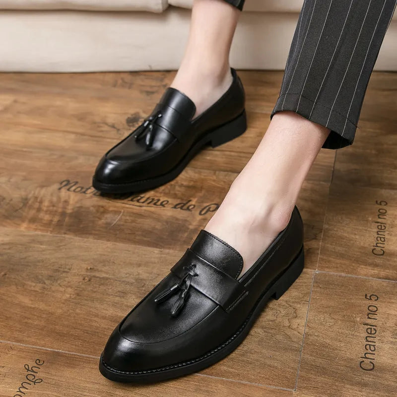 Men's black slip-on business casual shoes with tassel detailing and rubber sole