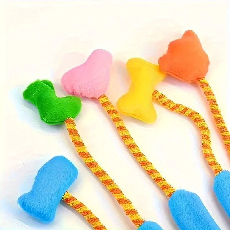 Yellow and blue plush glove cat toy with bell and trailers for interactive play