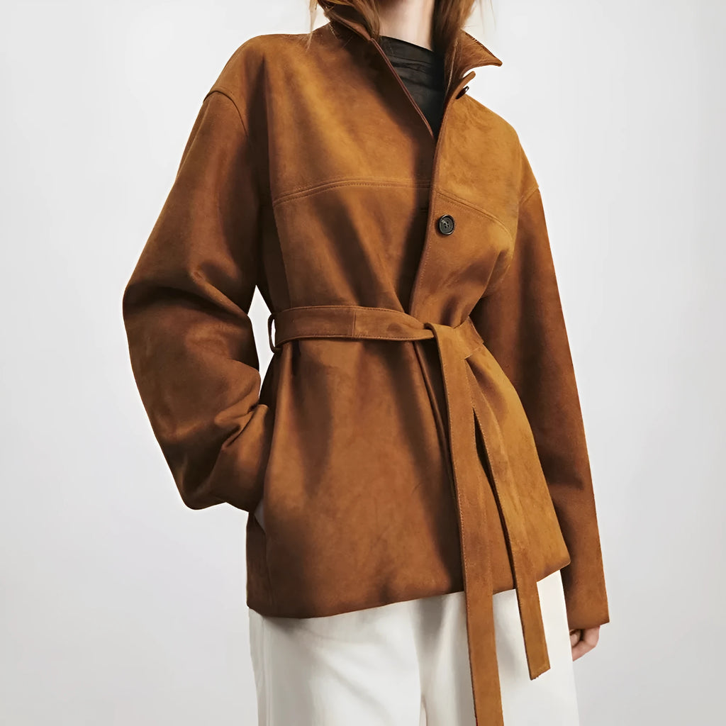 Women's caramel mocha cashmere coat with a peter pan collar and decorative leather stitching.