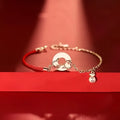 Festive koi bracelet with red rope design and peace buckle closure