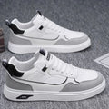 Men's solid-colour canvas board shoes with leather stitching and mesh lining.