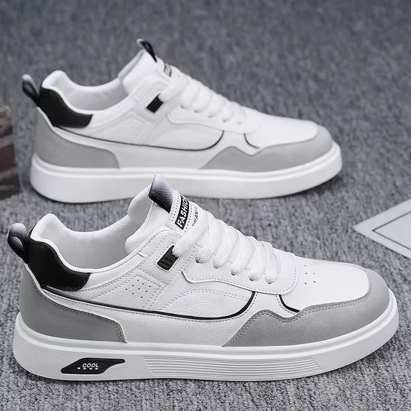 Men's solid-colour canvas board shoes with leather stitching and mesh lining.