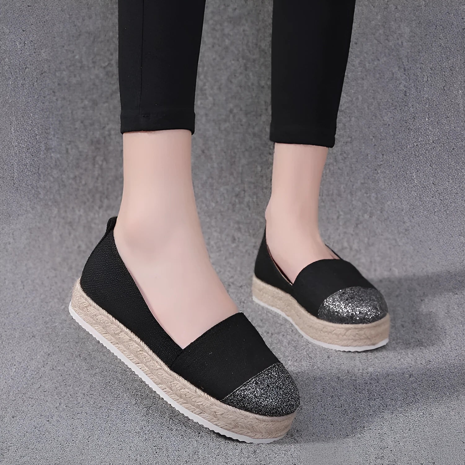 Plus size beige and black breathable canvas flat shoes with round toe and slip-on design.