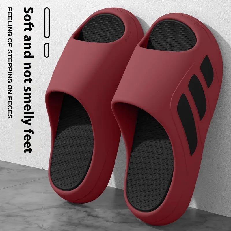 Brown and black two-tone EVA platform slippers with injection moulded soles on wooden floor
