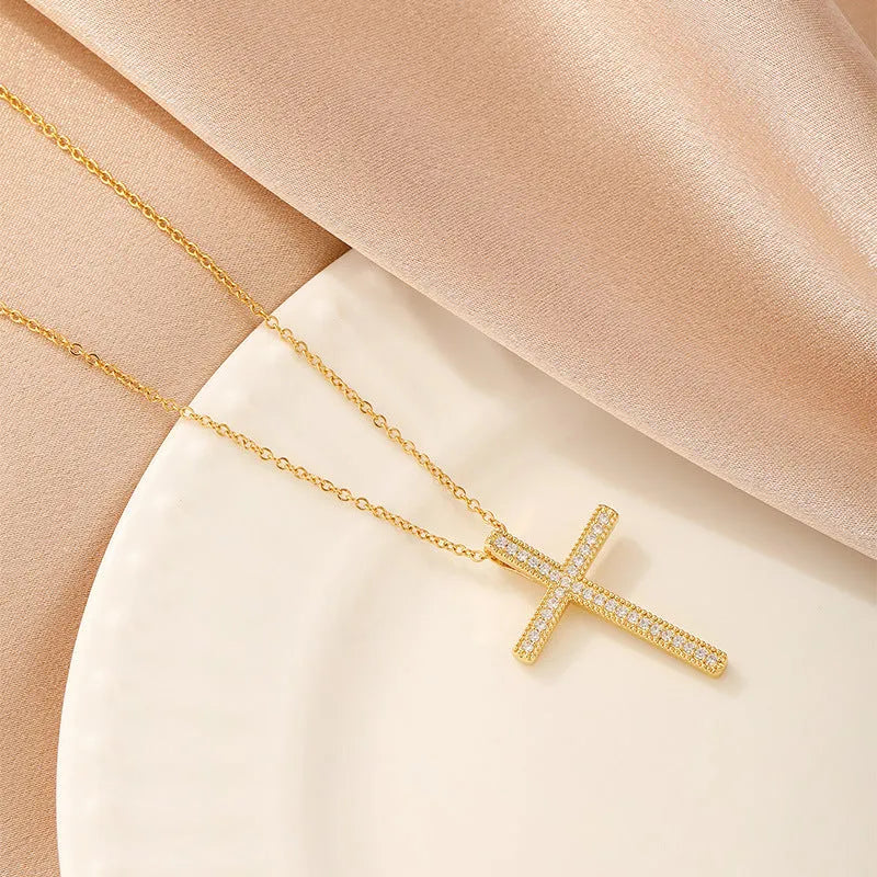 Women's copper necklace showing four pendant options: heart shape, round diamond, butterfly, and cross designs
