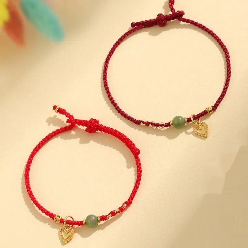 Handmade women's woven bracelet with 925 silver and Hetian jade in red strap option