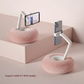 Adjustable rotating bracket holding a tablet on a desk, showing vertical lift and clamp mechanism.